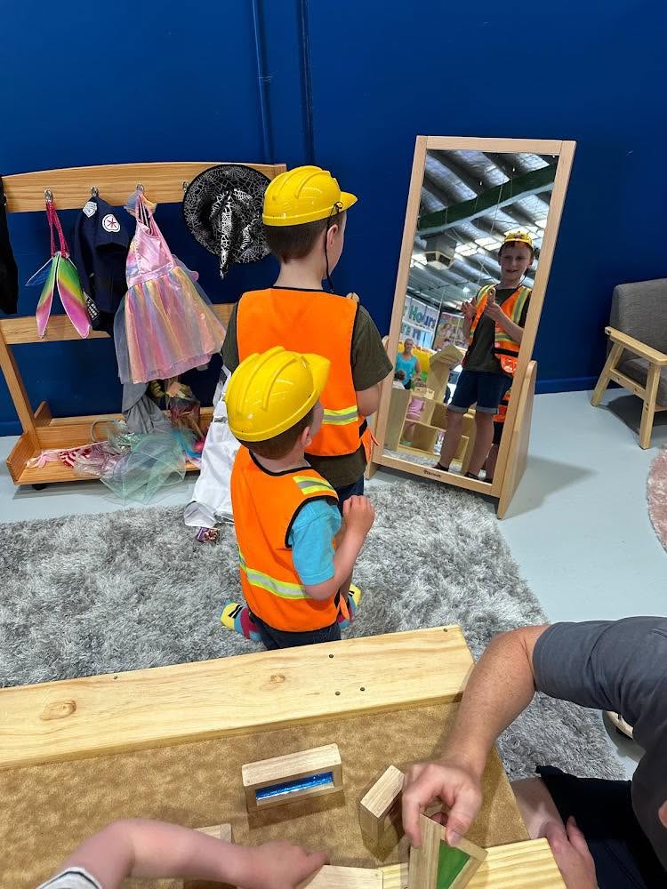 child dressed as builder