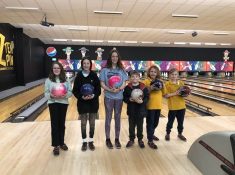 kids holding bowling balls
