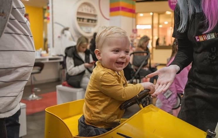 toddler in hair salon