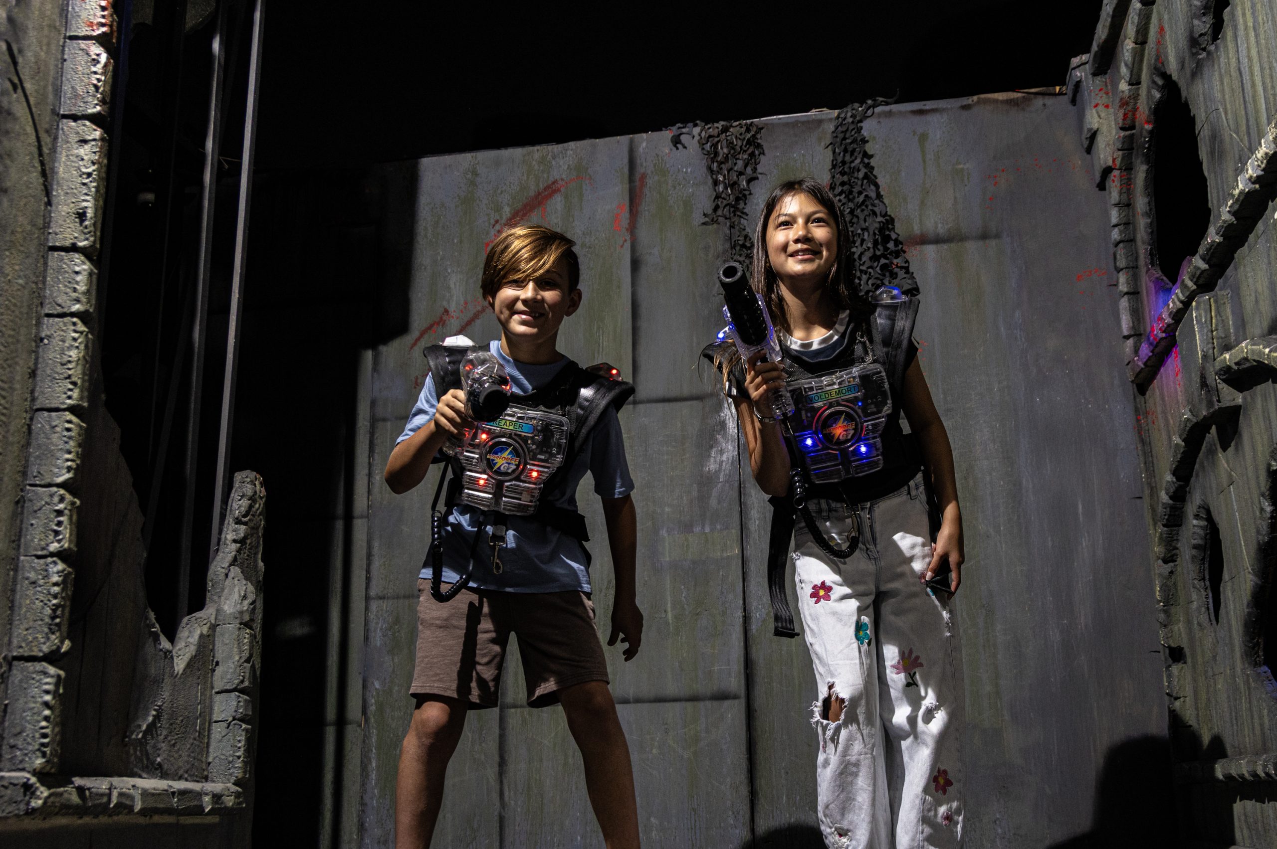 two kids with laser gun